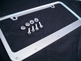 Nissan Xterra Chrome License Plate Frame Black Script Letters w/ Logo Screw Caps