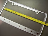 Nissan Xterra Chrome License Plate Frame Black Script Letters w/ Logo Screw Caps