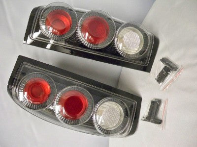 Winjet 1998-2000 Nissan Frontier Carbon Fiber Look Tail Lights Lamps Set Pair